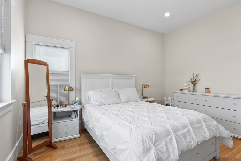 340 Main Street Everett, MA 02149 - Photo 27 of 42 a bedroom with a bed and a dresser