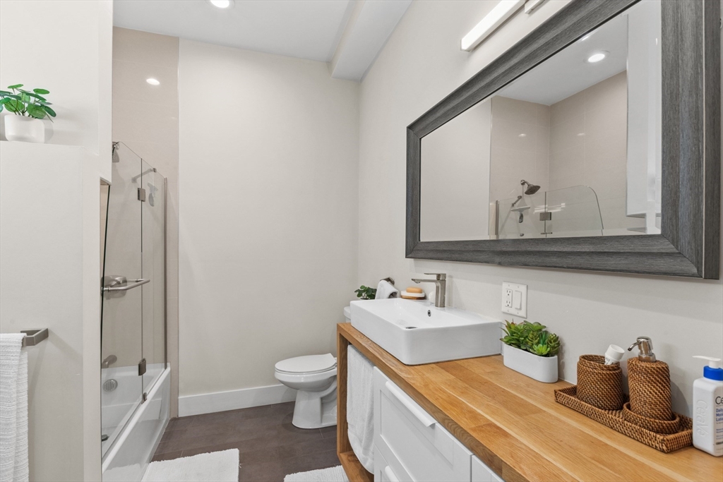 340 Main Street Everett, MA 02149 - Photo 29 of 42 a bathroom with a sink toilet and shower