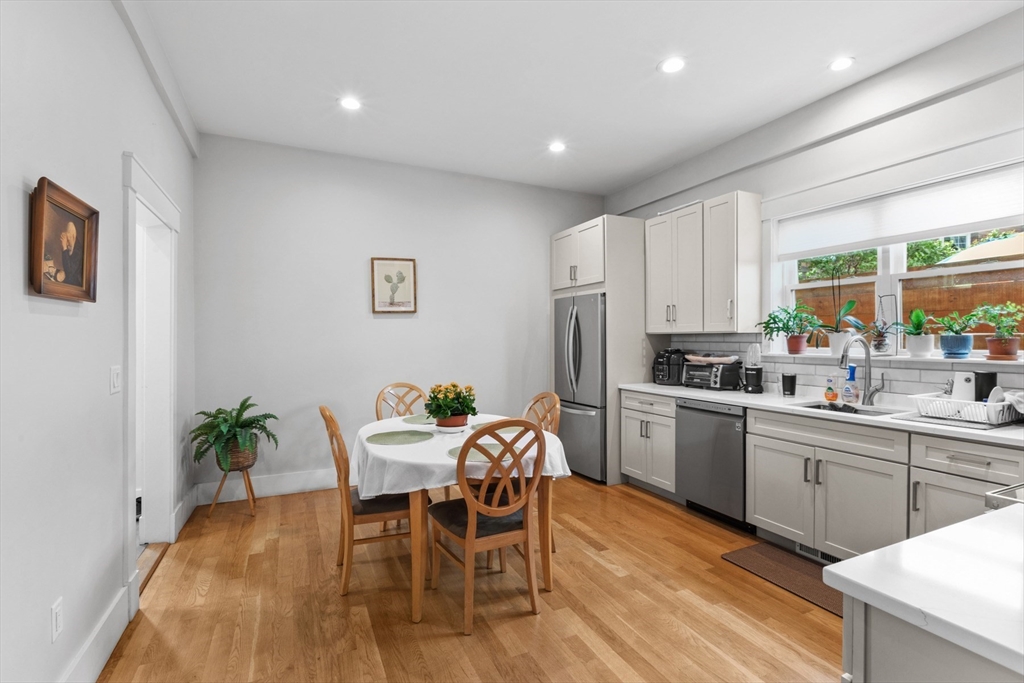 340 Main Street Everett, MA 02149 - Photo 30 of 42 a kitchen with a table and chairs in it