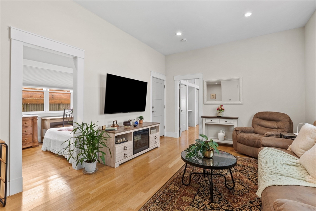 340 Main Street Everett, MA 02149 - Photo 33 of 42 a living room with furniture and a flat screen tv