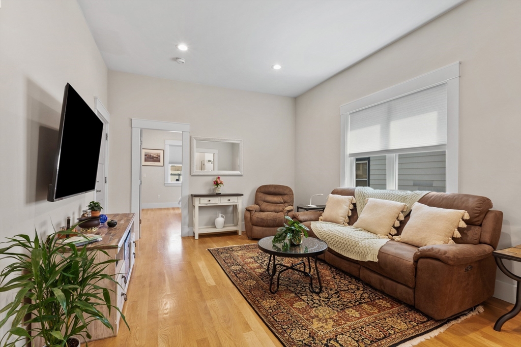 340 Main Street Everett, MA 02149 - Photo 34 of 42 a living room with furniture flat screen tv and windows
