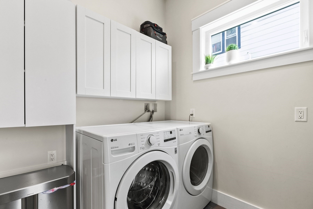 340 Main Street Everett, MA 02149 - Photo 37 of 42 a utility room with dryer and washer