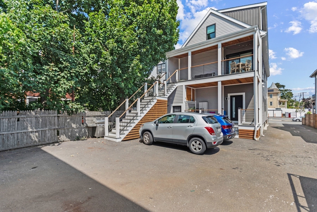 340 Main Street Everett, MA 02149 - Photo 6 of 42 a car parked in front of a house