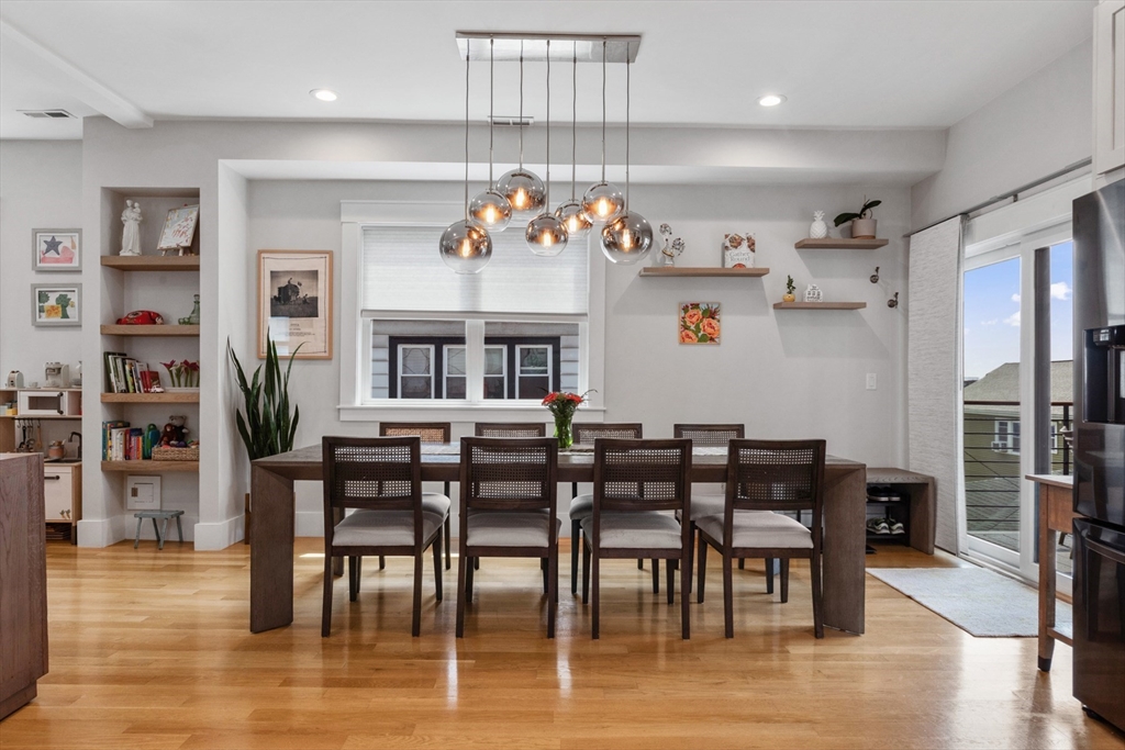 340 Main Street Everett, MA 02149 - Photo 8 of 42 a view of a dining room with furniture and wooden floor