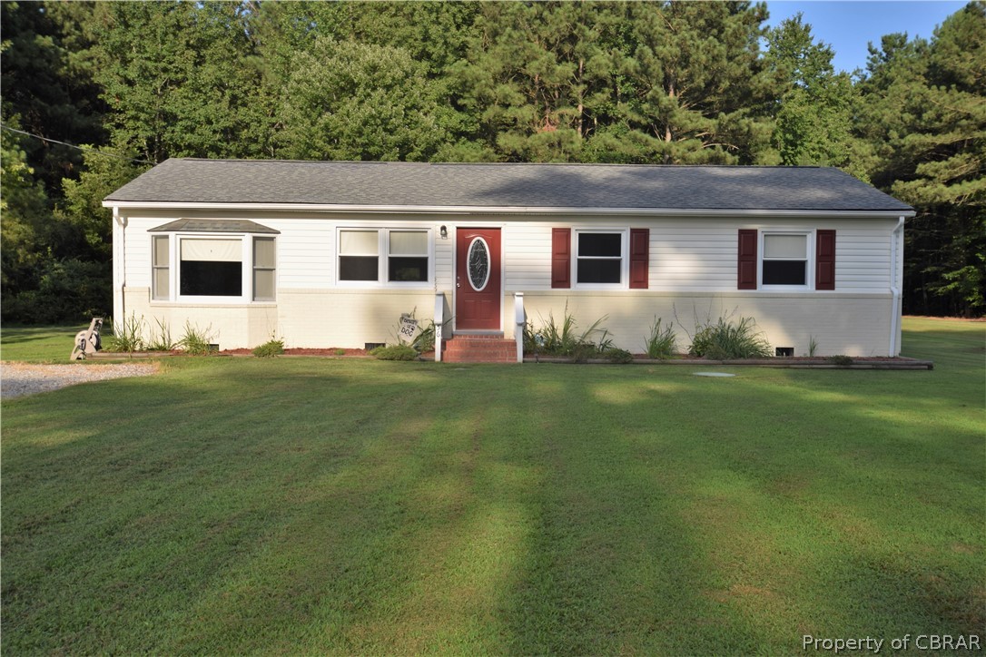 561 Possum Point Road Port Haywood, VA 23138 - Photo 3 of 23 a front view of house with yard