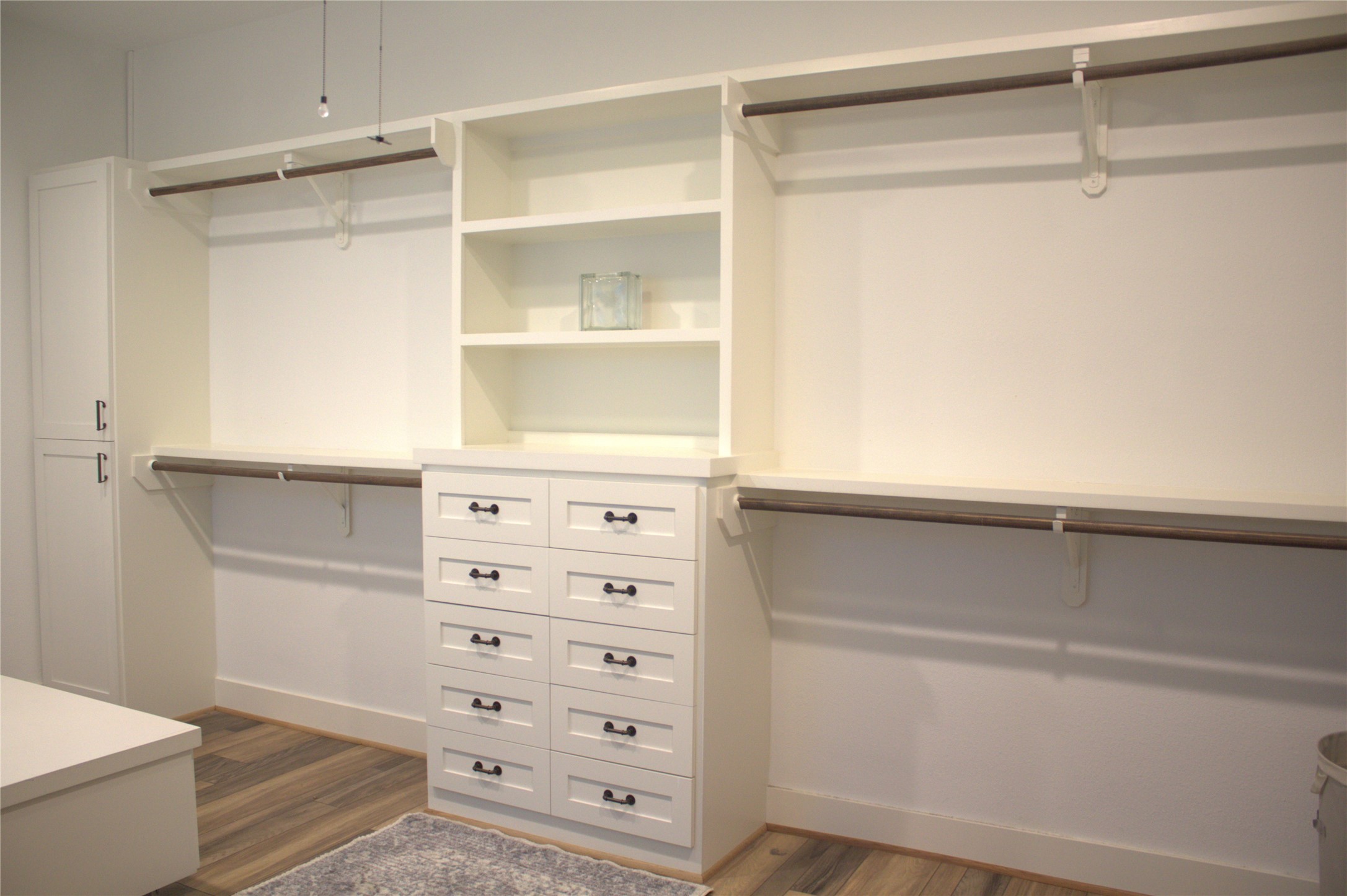 151 Key Largo Loop Point Blank, TX 77364 - Photo 21 of 49 Expansive custom walk-in-closet with built-in drawers shelving, cabinets, and dual hanging area.