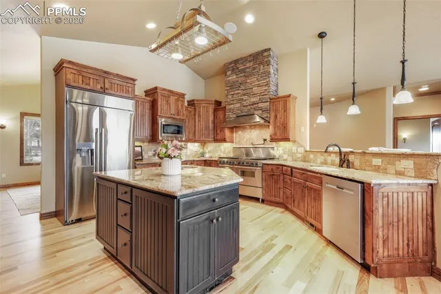 a spacious bedroom with a bed and a fireplace