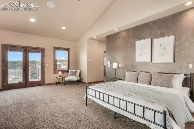 a living room with furniture and view of kitchen