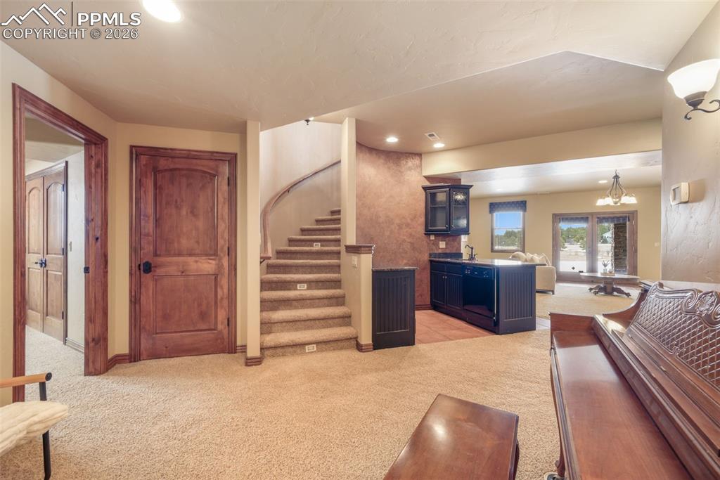 7830 Tannenbaum Road Colorado Springs, CO 80908 - Photo 30 of 50 a view of a livingroom with furniture and a kitchen