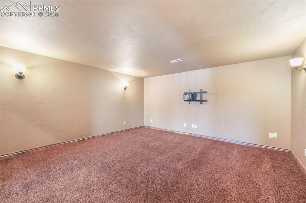 7830 Tannenbaum Road Colorado Springs, CO 80908 - Photo 38 of 50 an empty room with a empty space and windows