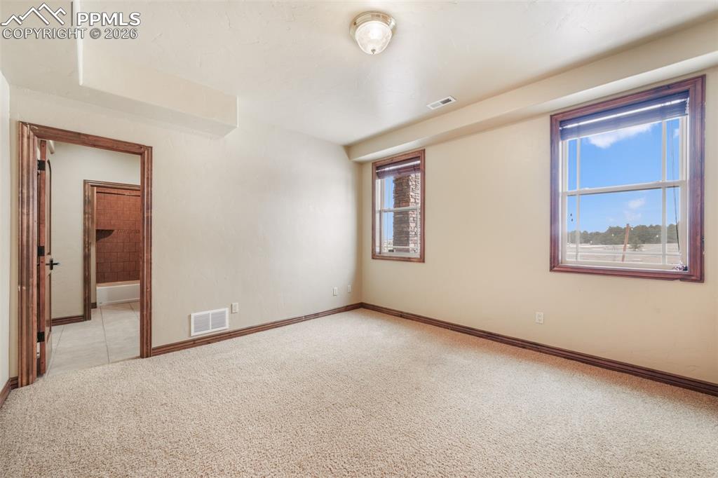 7830 Tannenbaum Road Colorado Springs, CO 80908 - Photo 41 of 50 a view of an empty room with a window