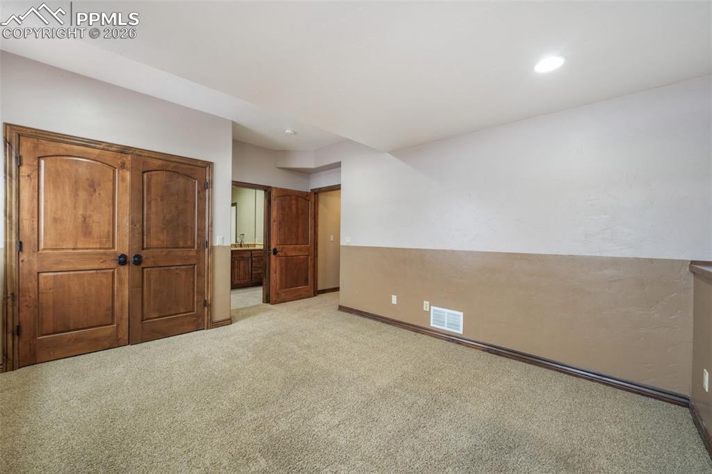7830 Tannenbaum Road Colorado Springs, CO 80908 - Photo 42 of 50 a view of an empty room with a kitchen