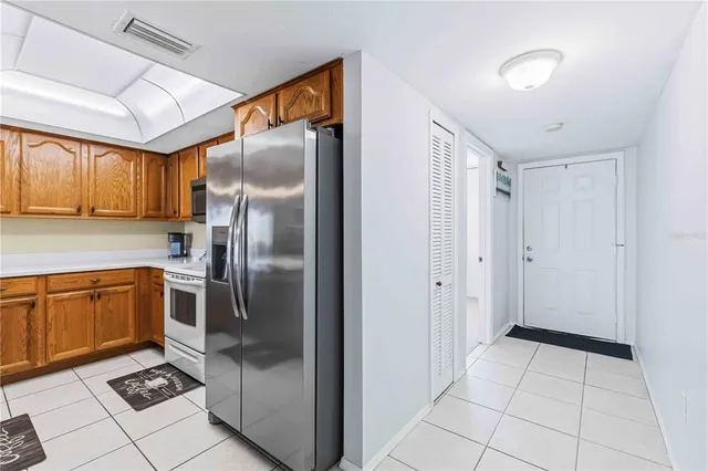 a living room with furniture a rug and a window