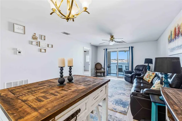 a kitchen with stainless steel appliances granite countertop a sink and a microwave