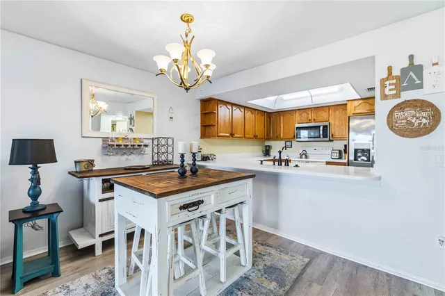 a view of an empty room with a cabinet and mirror
