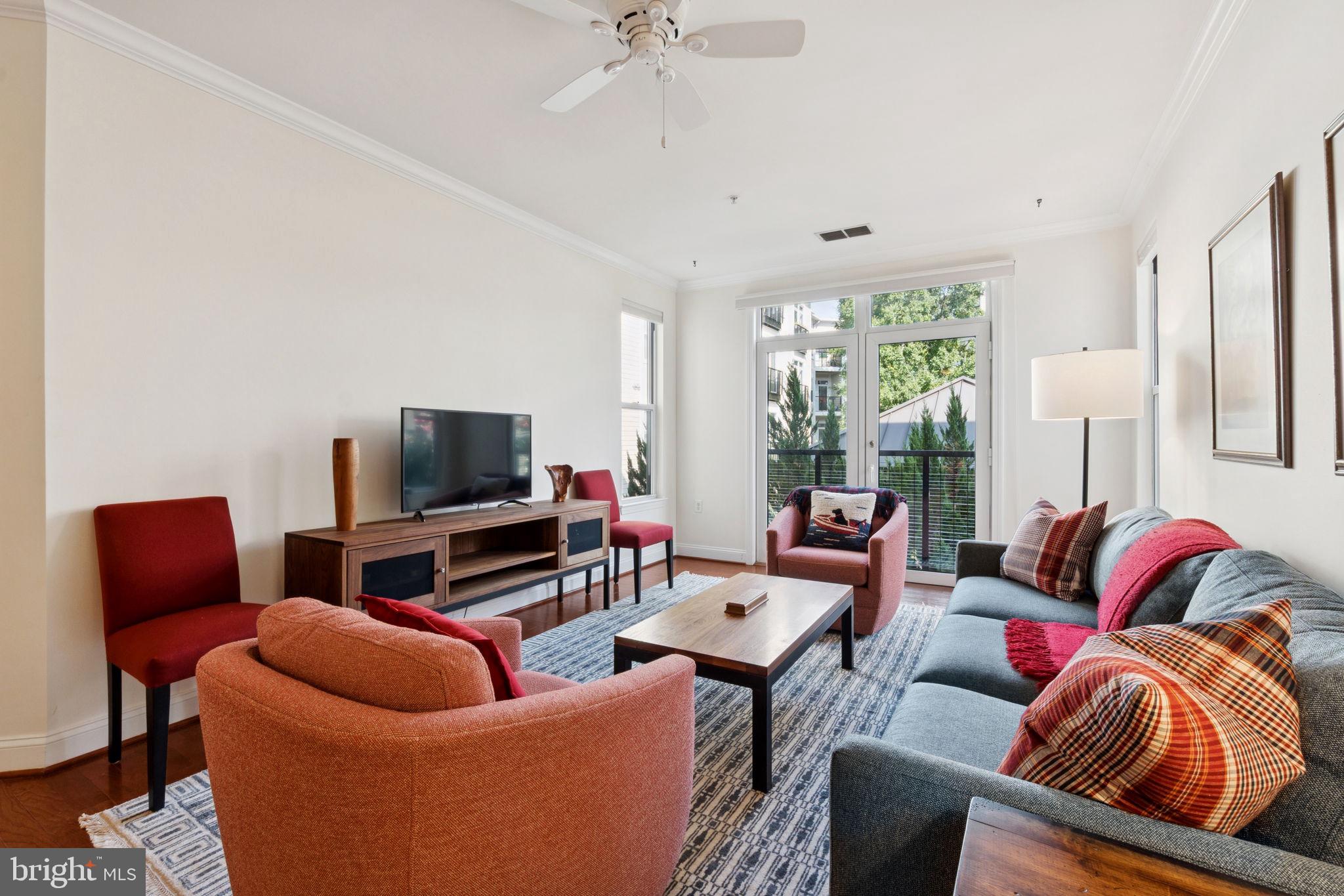 1391 Pennsylvania Ave. Southeast, Unit 352 Washington, DC 20003 - Photo 11 of 43 a living room with furniture and a flat screen tv