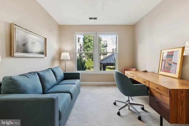 a work room with furniture and a window