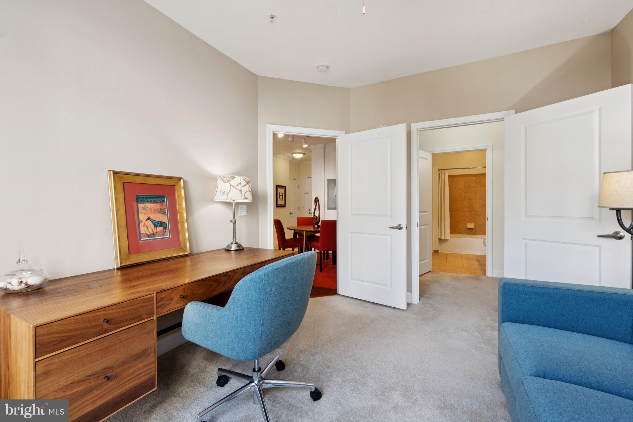 1391 Pennsylvania Ave. Southeast, Unit 352 Washington, DC 20003 - Photo 24 of 43 a living room with furniture and a view of bathroom