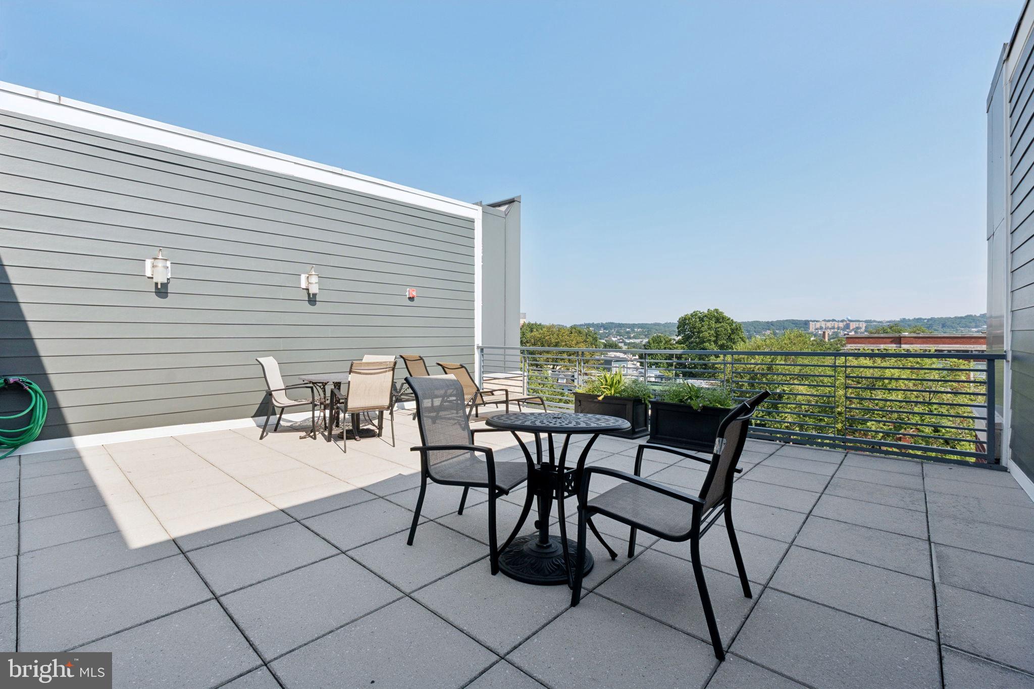 1391 Pennsylvania Ave. Southeast, Unit 352 Washington, DC 20003 - Photo 39 of 43 a view of a chairs and table in patio