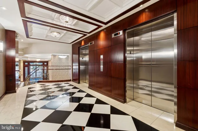 a bathroom with a glass door shower and a sink