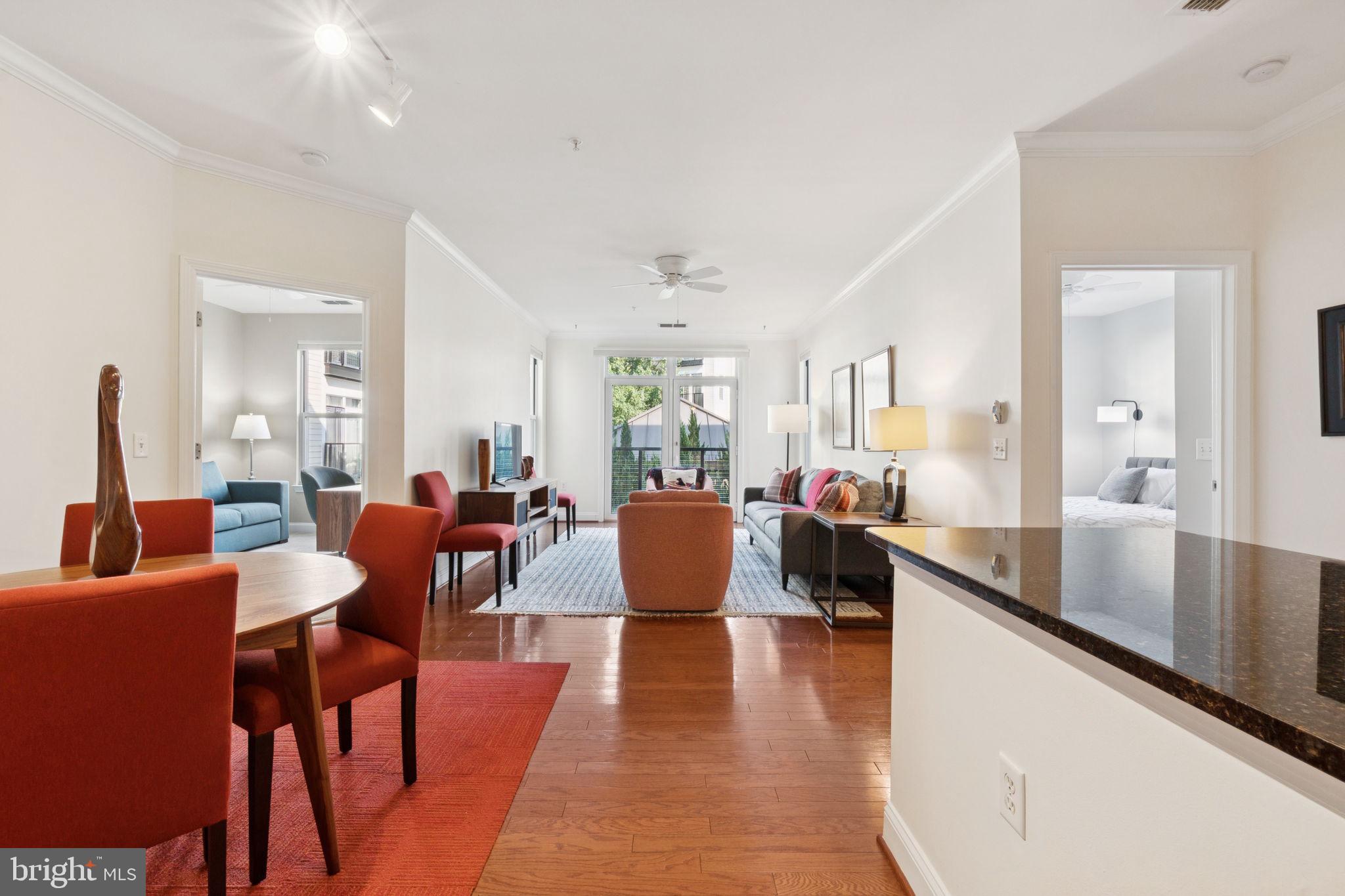 1391 Pennsylvania Ave. Southeast, Unit 352 Washington, DC 20003 - Photo 5 of 43 a view of a dining room with furniture and wooden floor