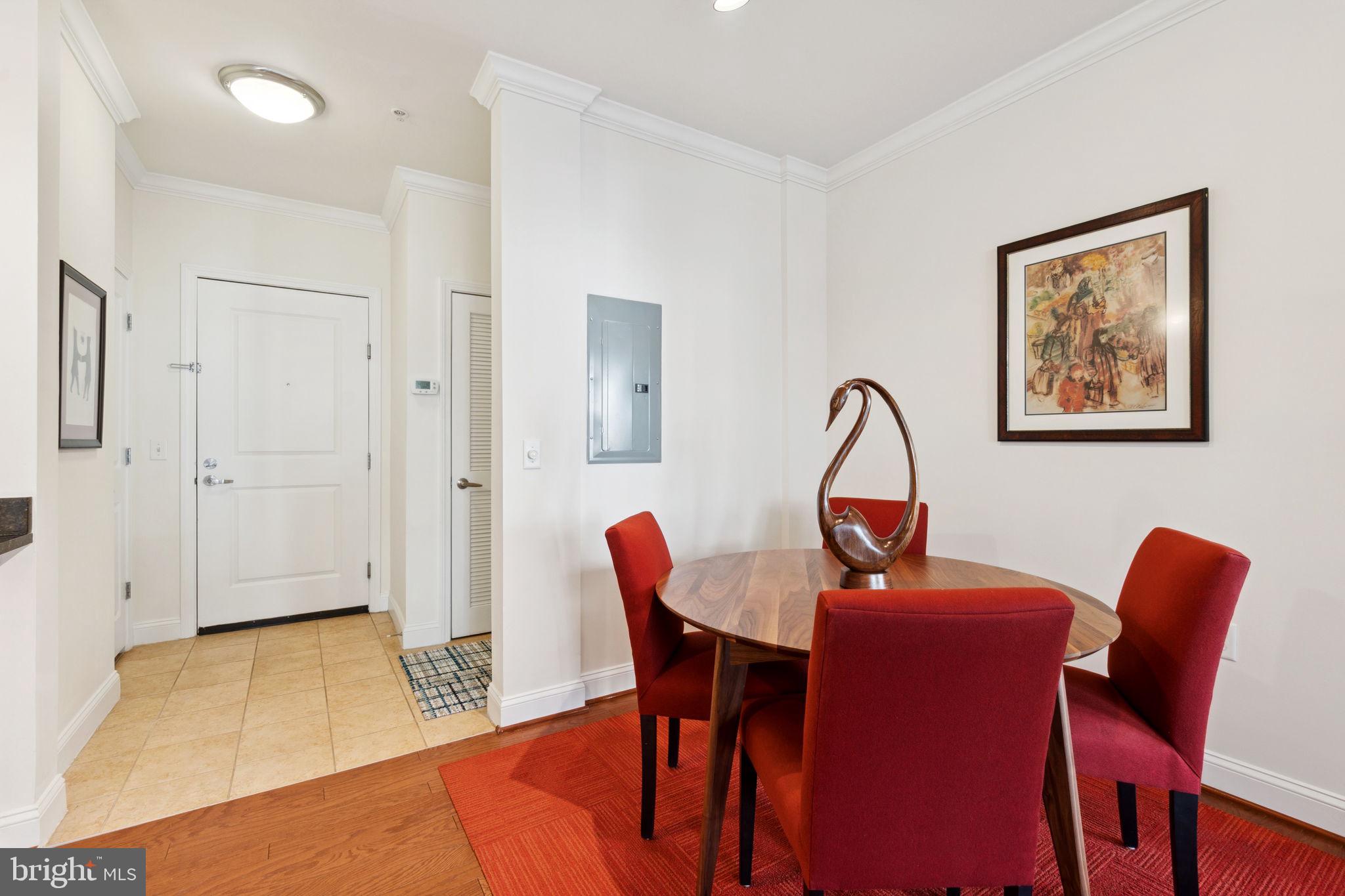 1391 Pennsylvania Ave. Southeast, Unit 352 Washington, DC 20003 - Photo 6 of 43 a dining room with furniture and wooden floor