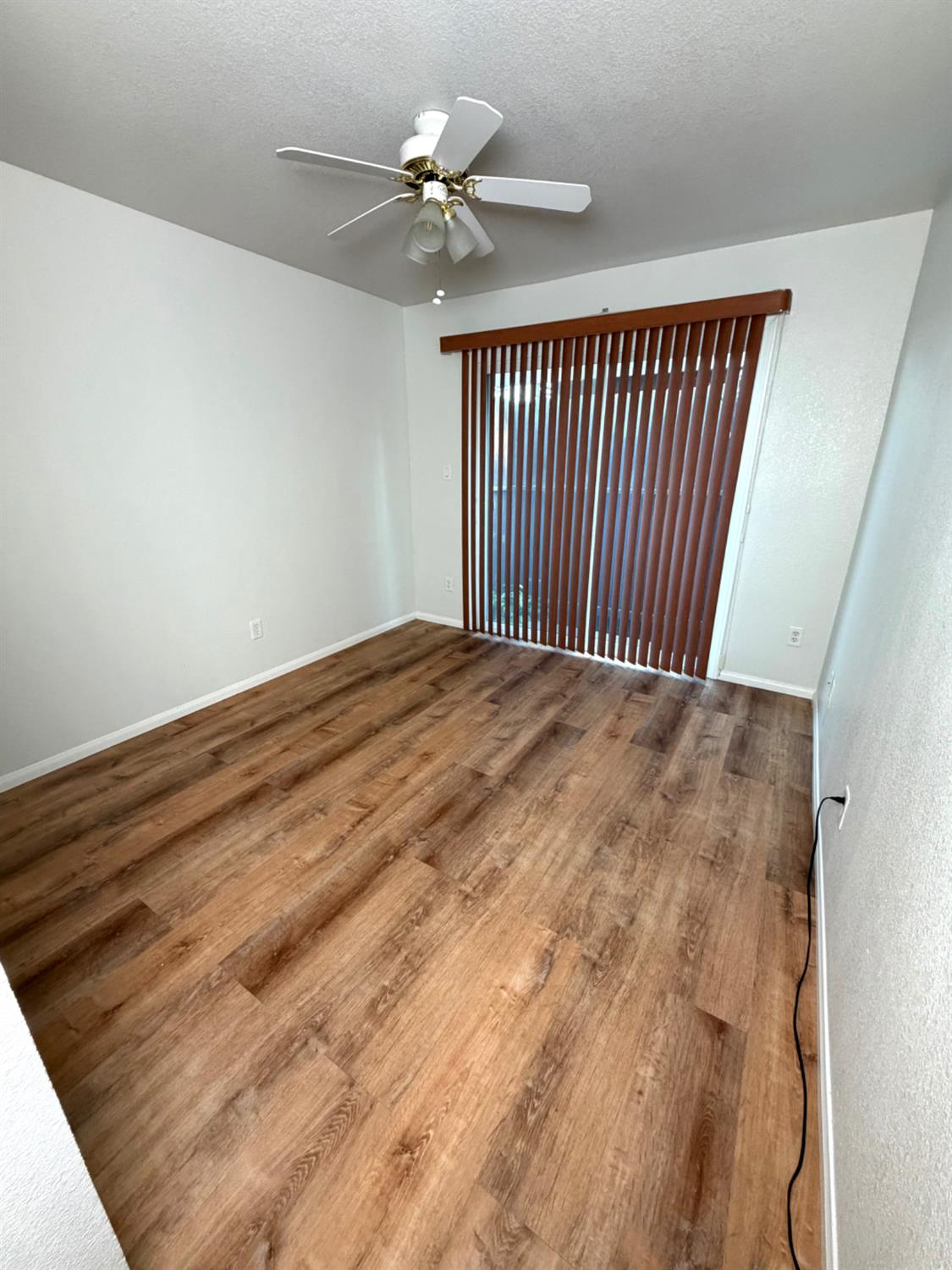 5000 Bremner Way, Unit 4 Sacramento, CA 95841 - Photo 13 of 23 a view of a room with wooden floor