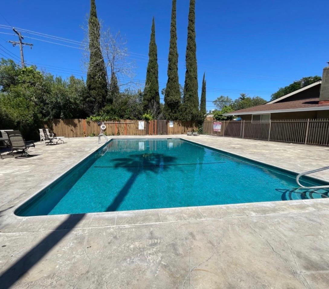 5000 Bremner Way, Unit 4 Sacramento, CA 95841 - Photo 22 of 23 a view of a swimming pool with a patio