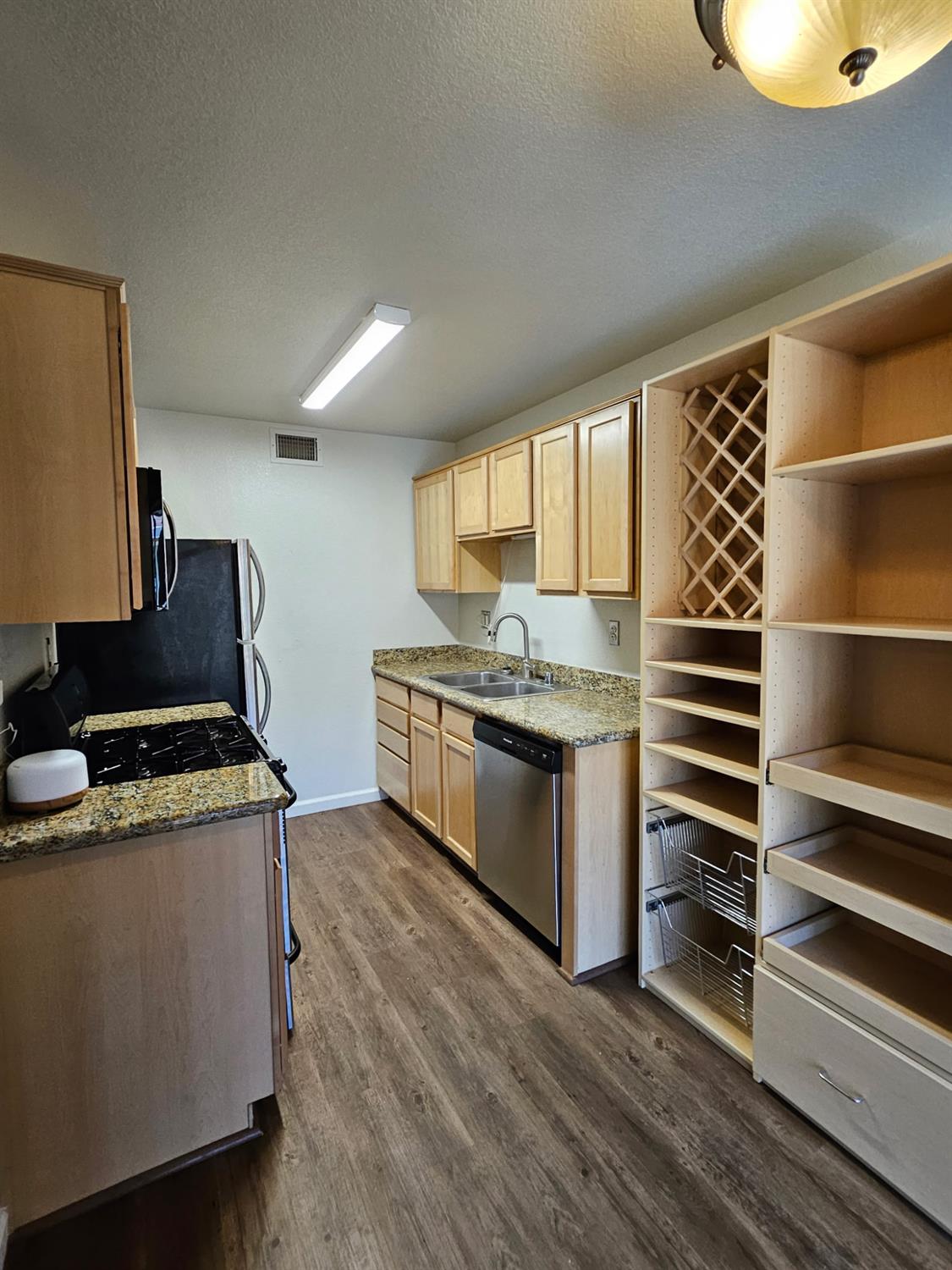 5000 Bremner Way, Unit 4 Sacramento, CA 95841 - Photo 3 of 23 a kitchen with a stove and a sink