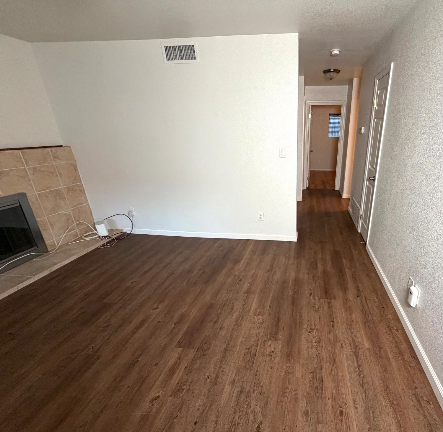 5000 Bremner Way, Unit 4 Sacramento, CA 95841 - Photo 7 of 23 a view of a hallway with wooden floor