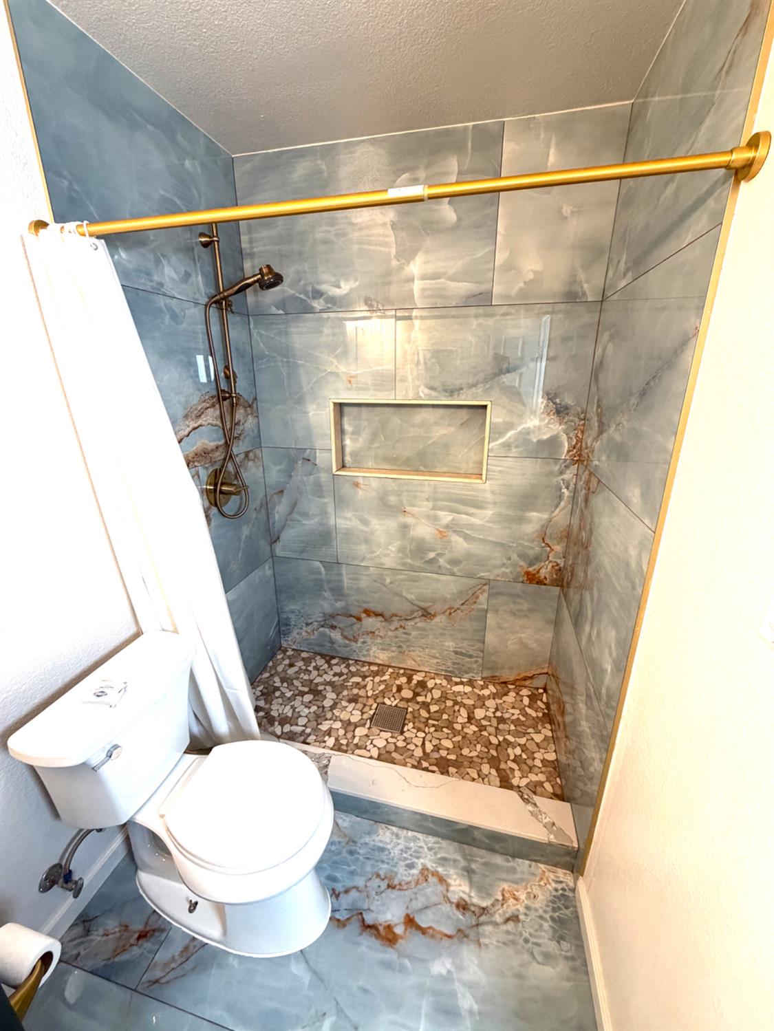 5000 Bremner Way, Unit 4 Sacramento, CA 95841 - Photo 9 of 23 a bathroom with a shower and a toilet