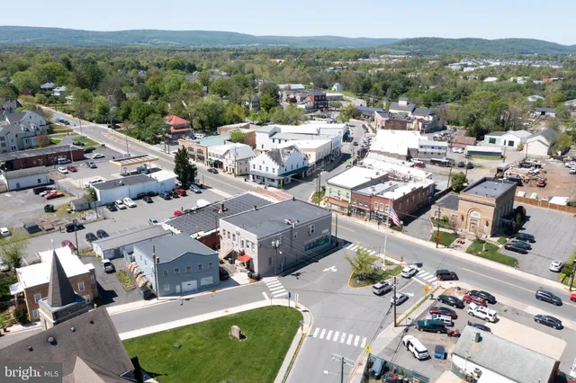 an aerial view of a house with a garden