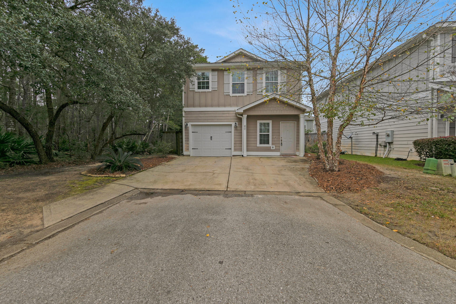 40 Horn Beam Way Santa Rosa Beach, FL 32459 - Photo 1 of 37 a front view of a house with a yard and garage
