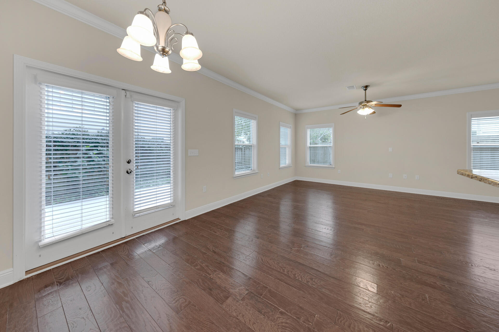 40 Horn Beam Way Santa Rosa Beach, FL 32459 - Photo 11 of 37 a view of an empty room with wooden floor and a window