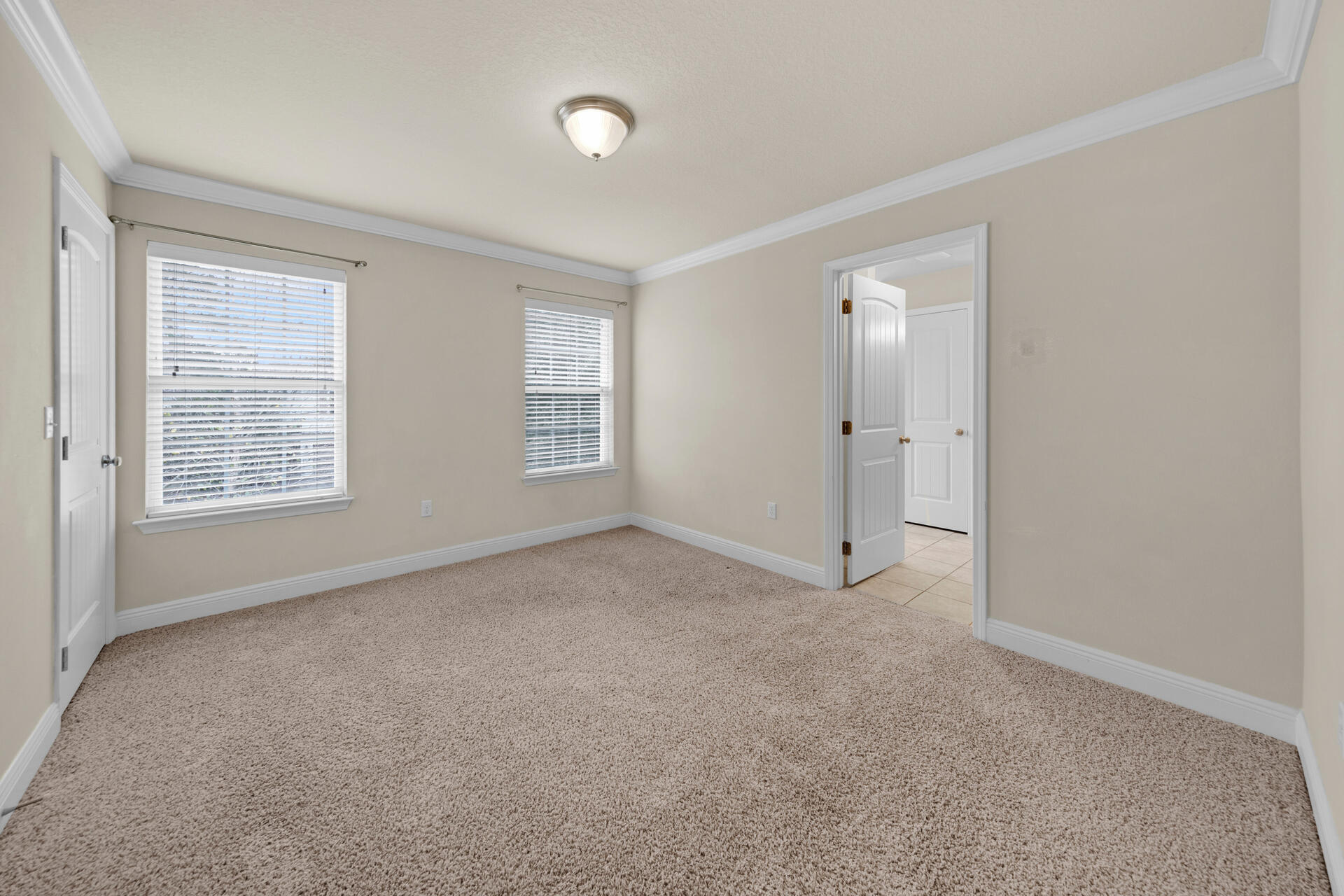40 Horn Beam Way Santa Rosa Beach, FL 32459 - Photo 14 of 37 an empty room with windows and closet
