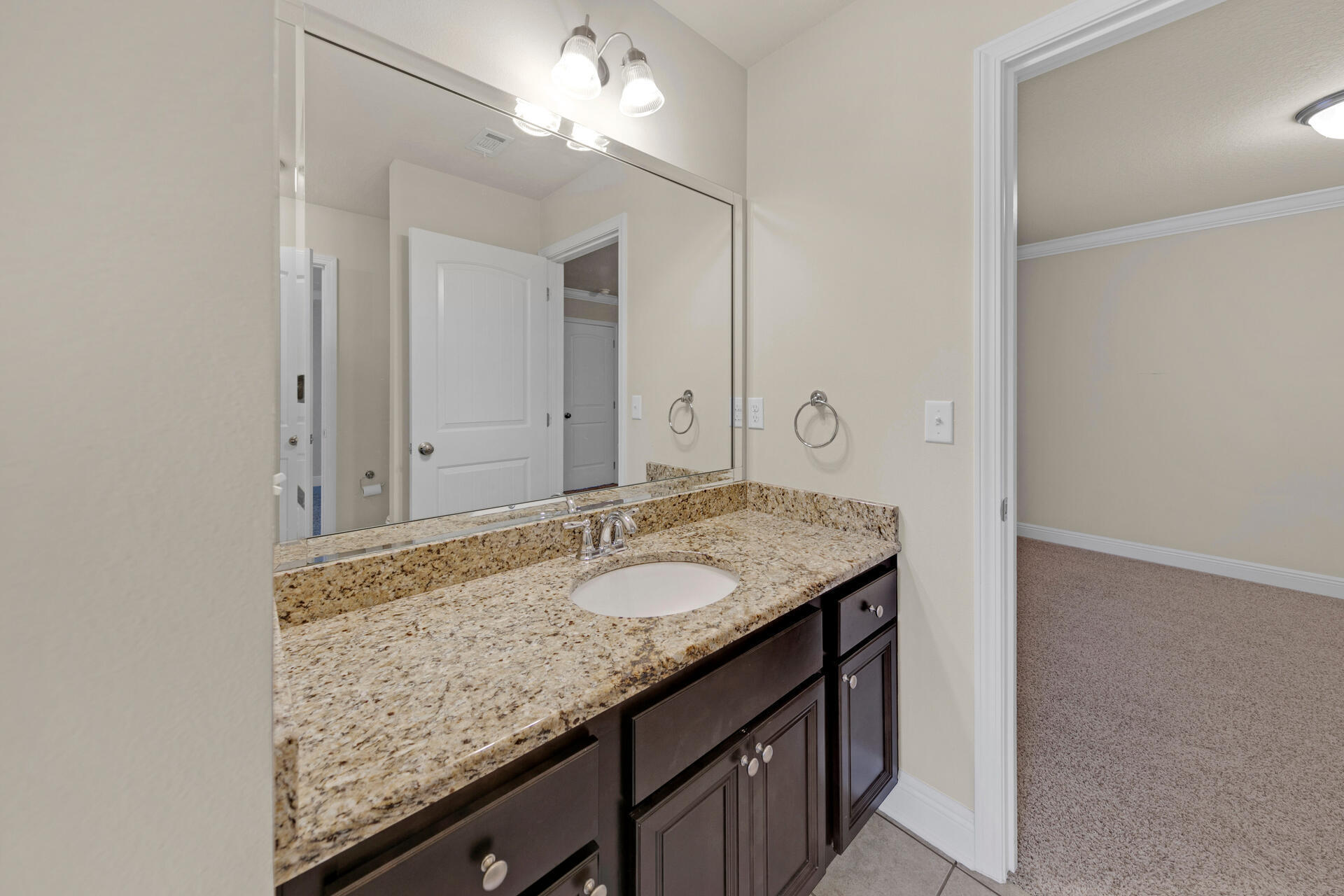 40 Horn Beam Way Santa Rosa Beach, FL 32459 - Photo 18 of 37 a bathroom with a granite countertop sink and a mirror