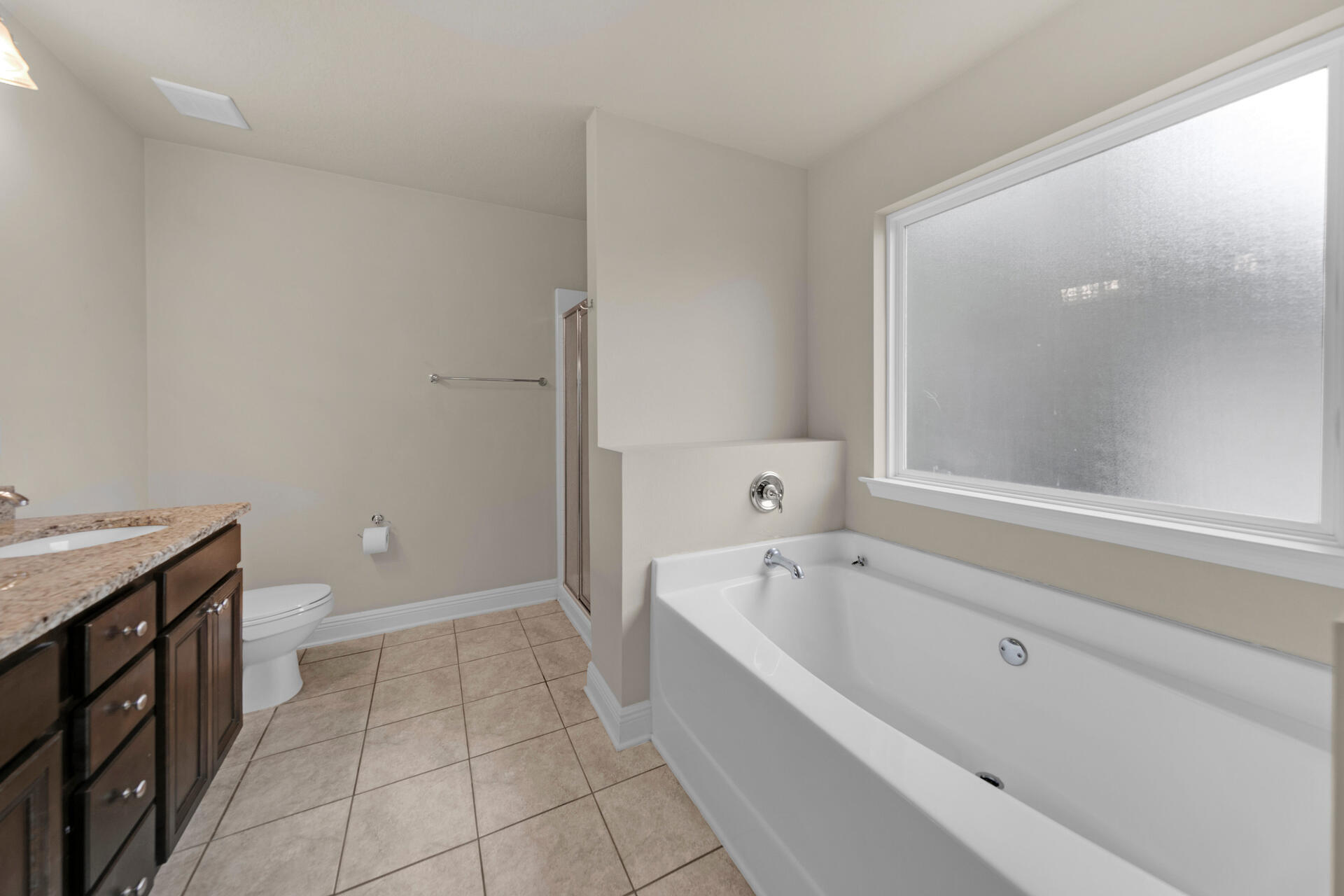 40 Horn Beam Way Santa Rosa Beach, FL 32459 - Photo 25 of 37 a spacious bathroom with a granite countertop tub a toilet and a sink