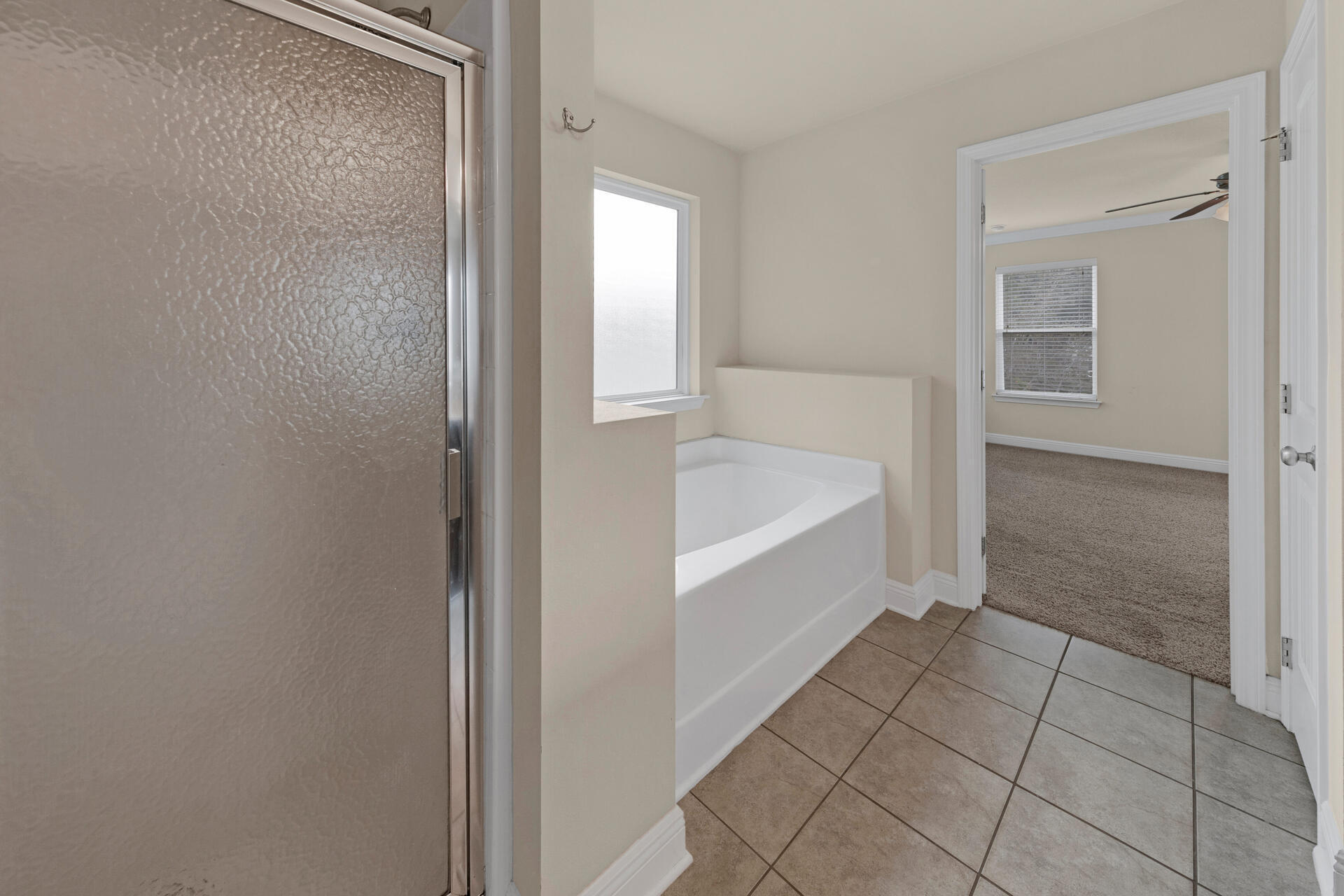 40 Horn Beam Way Santa Rosa Beach, FL 32459 - Photo 27 of 37 a bathroom with a bathtub and shower