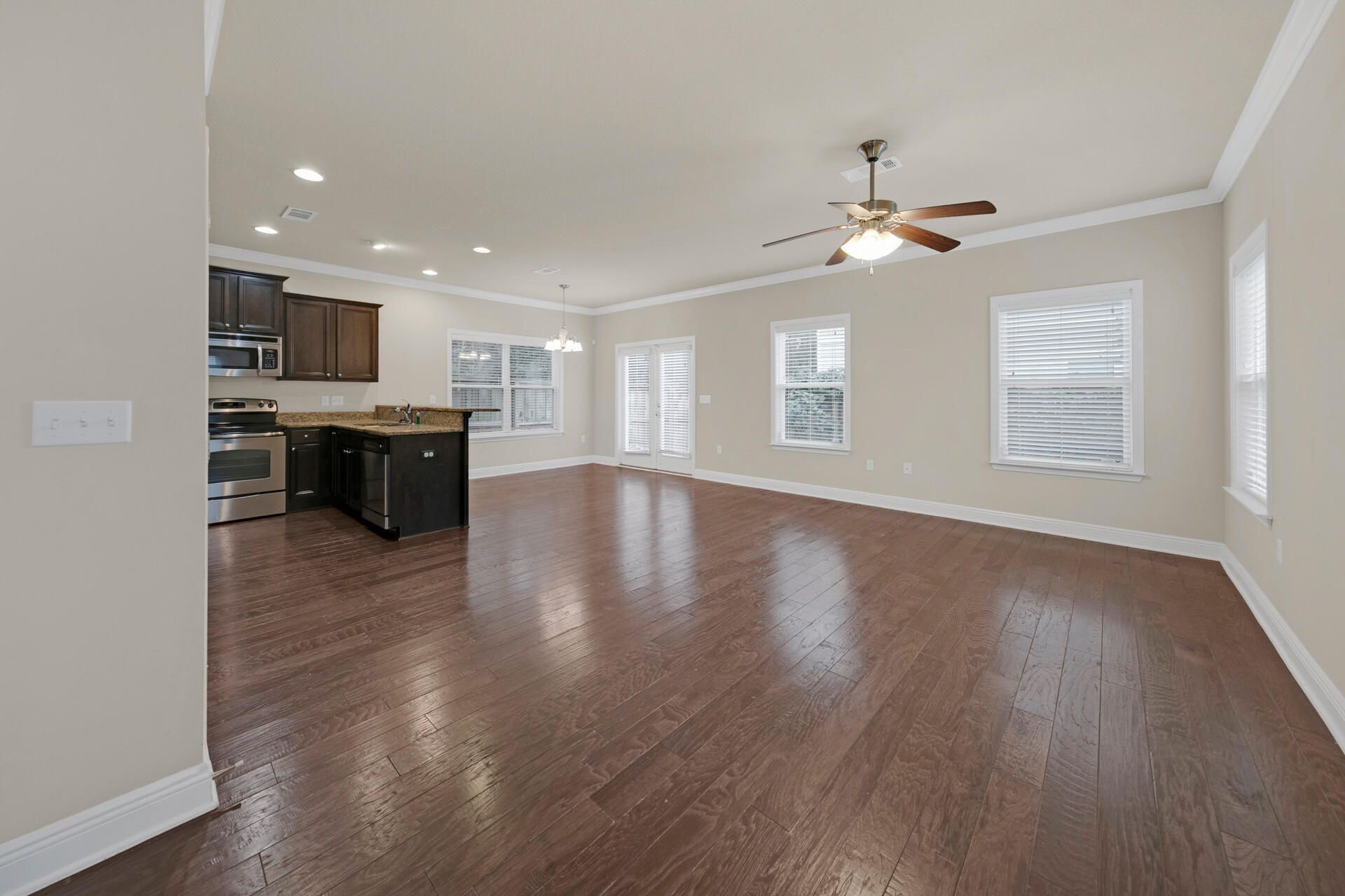 40 Horn Beam Way Santa Rosa Beach, FL 32459 - Photo 8 of 37 a view of a livingroom with furniture wooden floor and chandelier