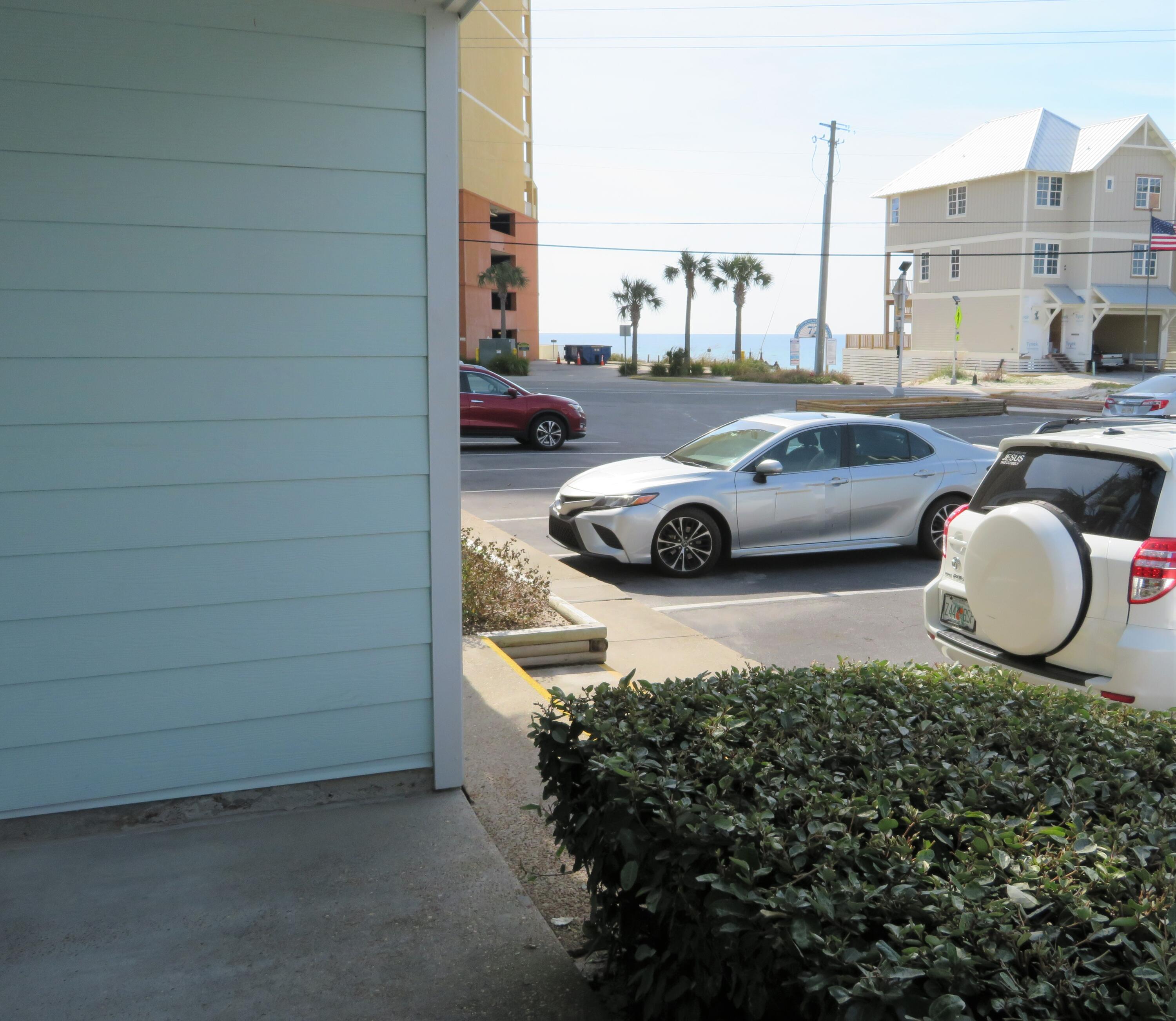 17670 Front Beach Road, Unit B4 Panama City Beach, FL 32413 - Photo 14 of 14 a car parked in parking lot of a building