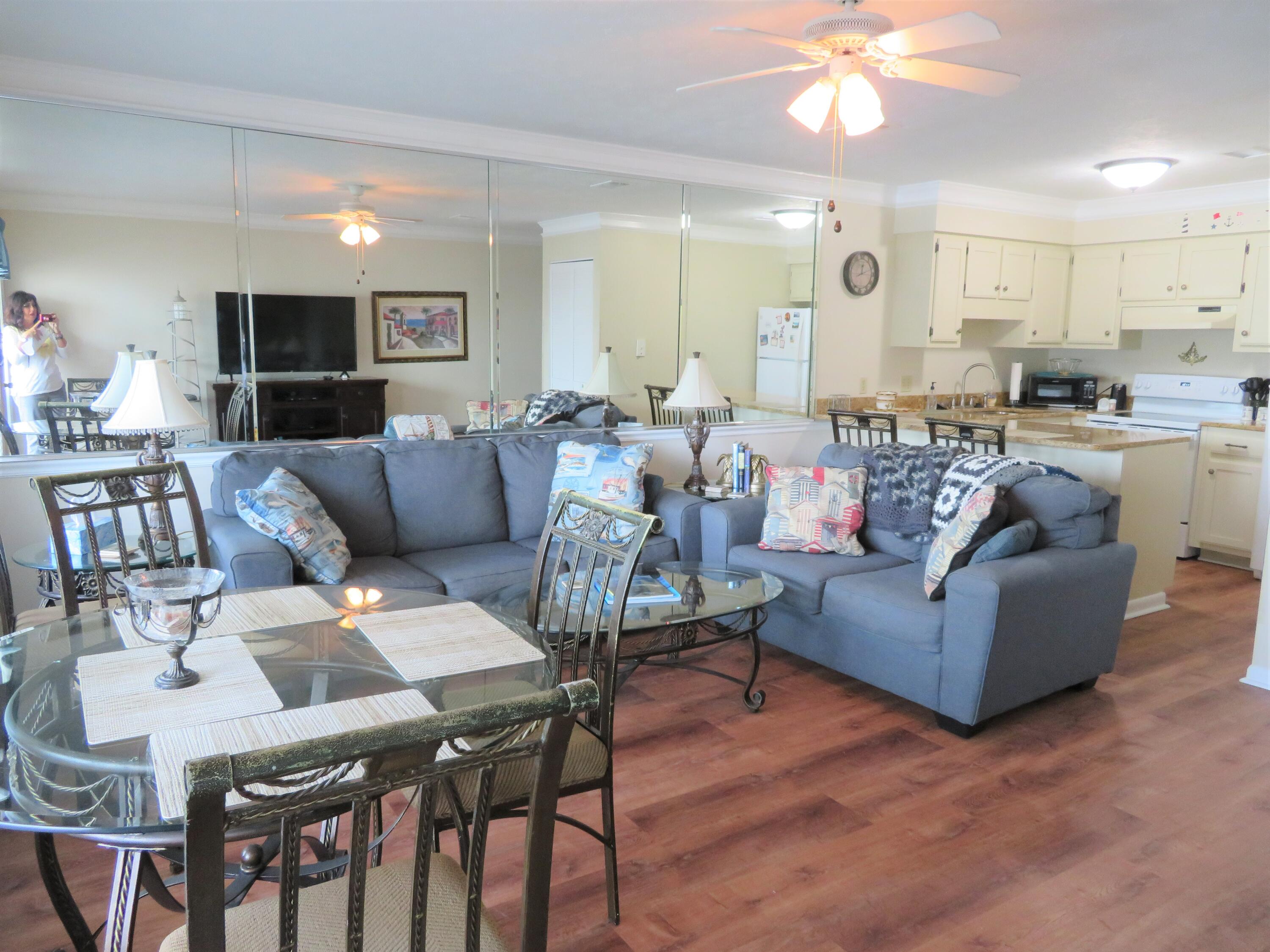 17670 Front Beach Road, Unit B4 Panama City Beach, FL 32413 - Photo 3 of 14 a living room with furniture and a view of kitchen