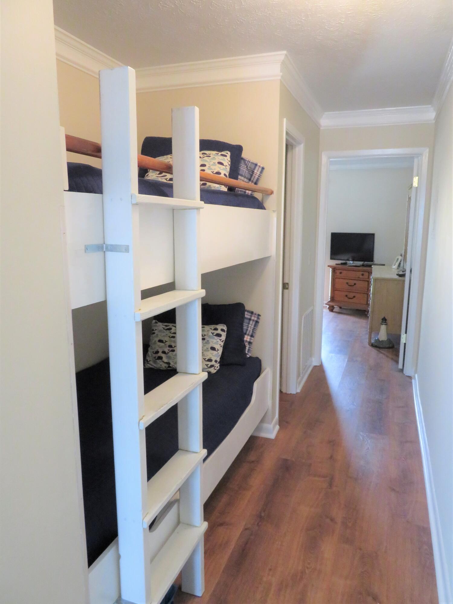 17670 Front Beach Road, Unit B4 Panama City Beach, FL 32413 - Photo 7 of 14 a living room with furniture and a fireplace