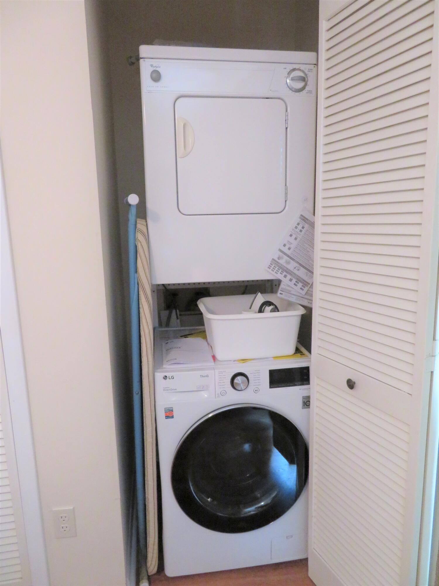 17670 Front Beach Road, Unit B4 Panama City Beach, FL 32413 - Photo 10 of 14 a utility room with dryer and washer