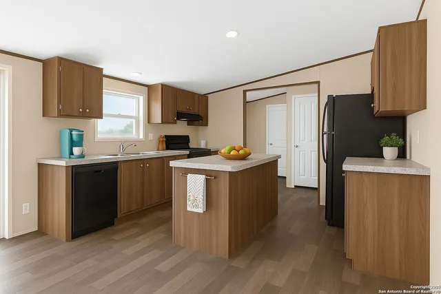 a kitchen with a refrigerator sink and cabinets