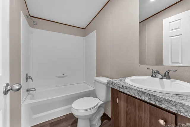 a bathroom with a sink a toilet and a bathtub