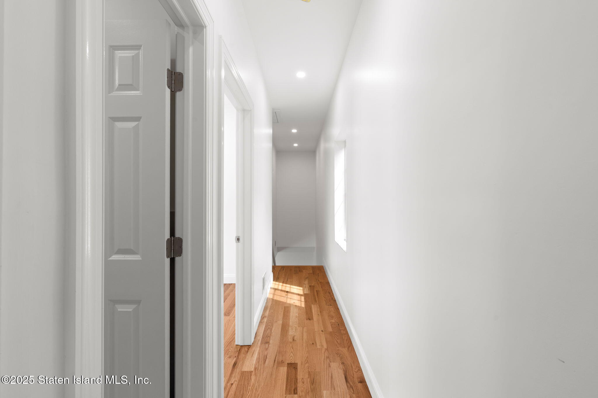 1384 Clove Road Staten Island, NY 10301 - Photo 13 of 51 a view of a hallway with wooden floor