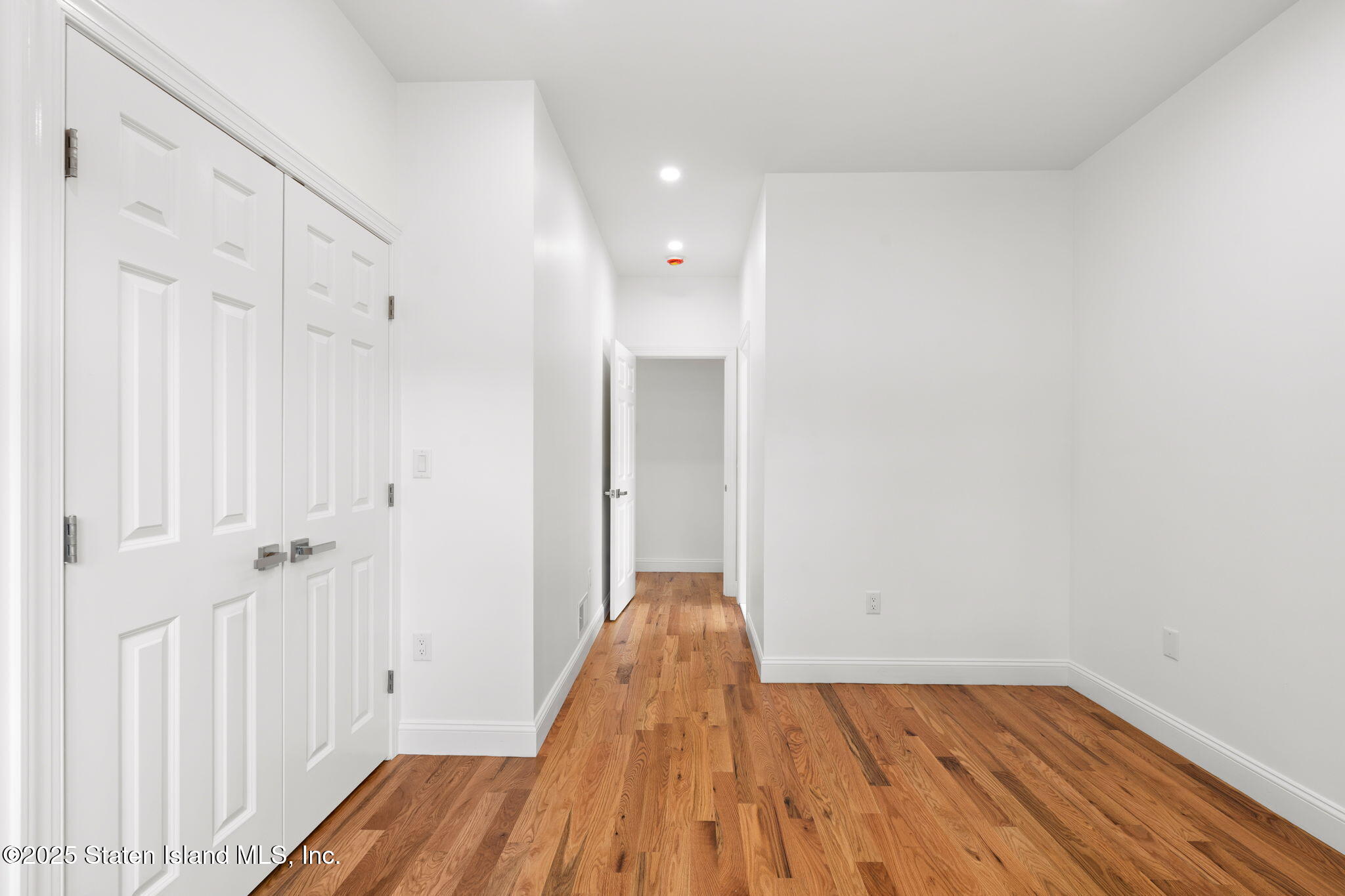 1384 Clove Road Staten Island, NY 10301 - Photo 17 of 51 a view of a room with wooden floor and a hallway