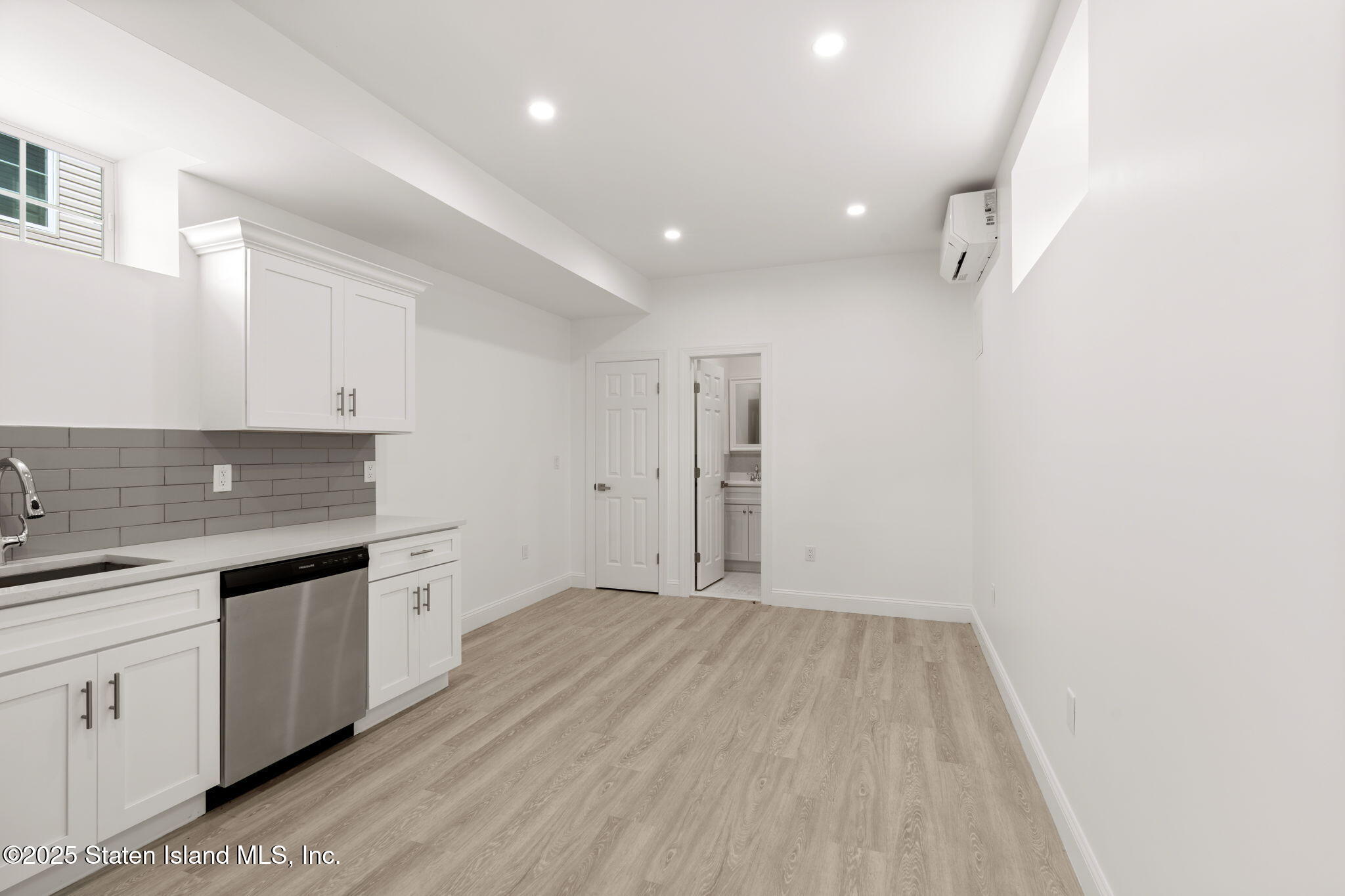 1384 Clove Road Staten Island, NY 10301 - Photo 37 of 51 a view of kitchen with a sink wooden floor and window