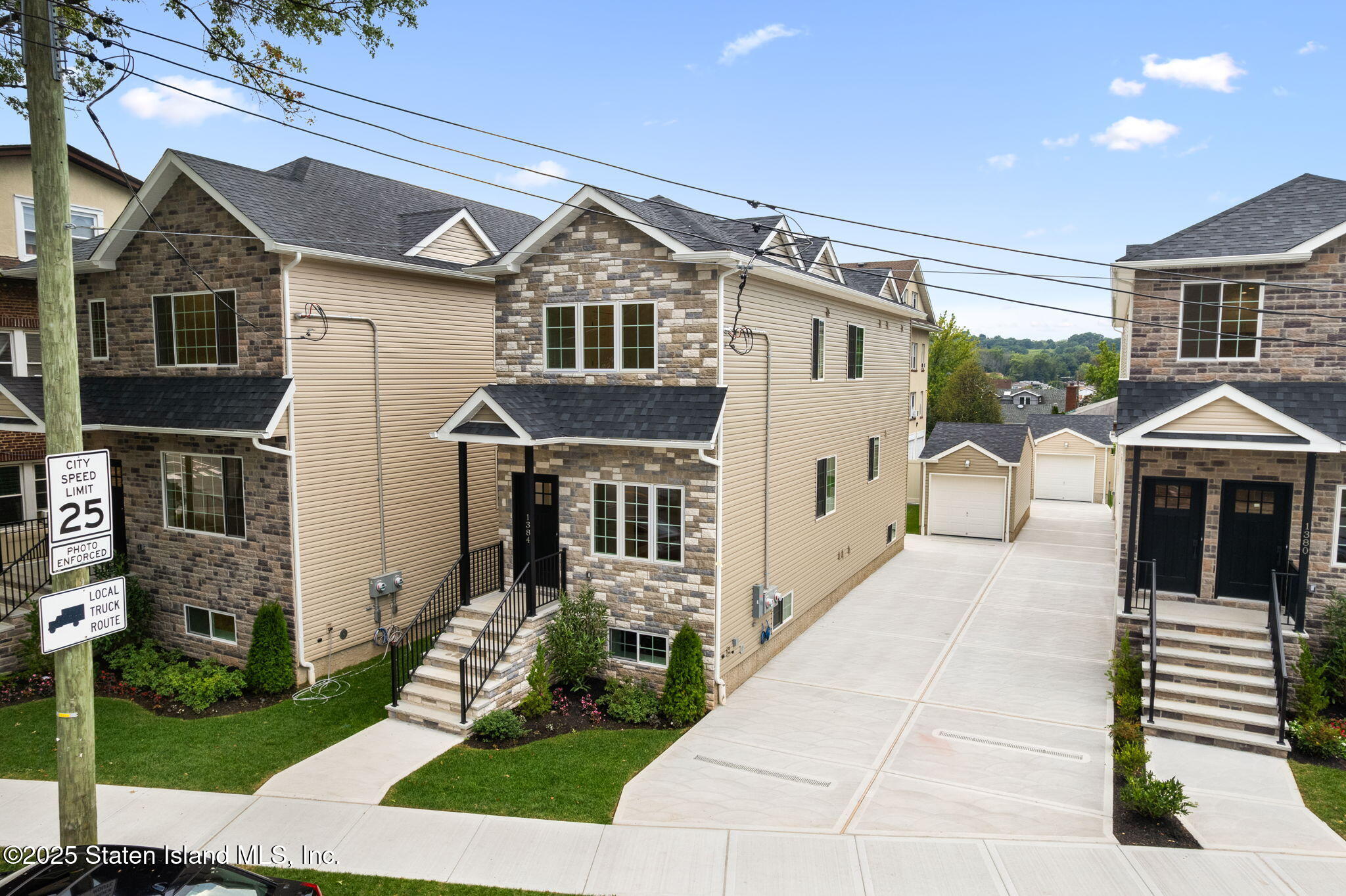 1384 Clove Road Staten Island, NY 10301 - Photo 4 of 51 a front view of a house with a yard
