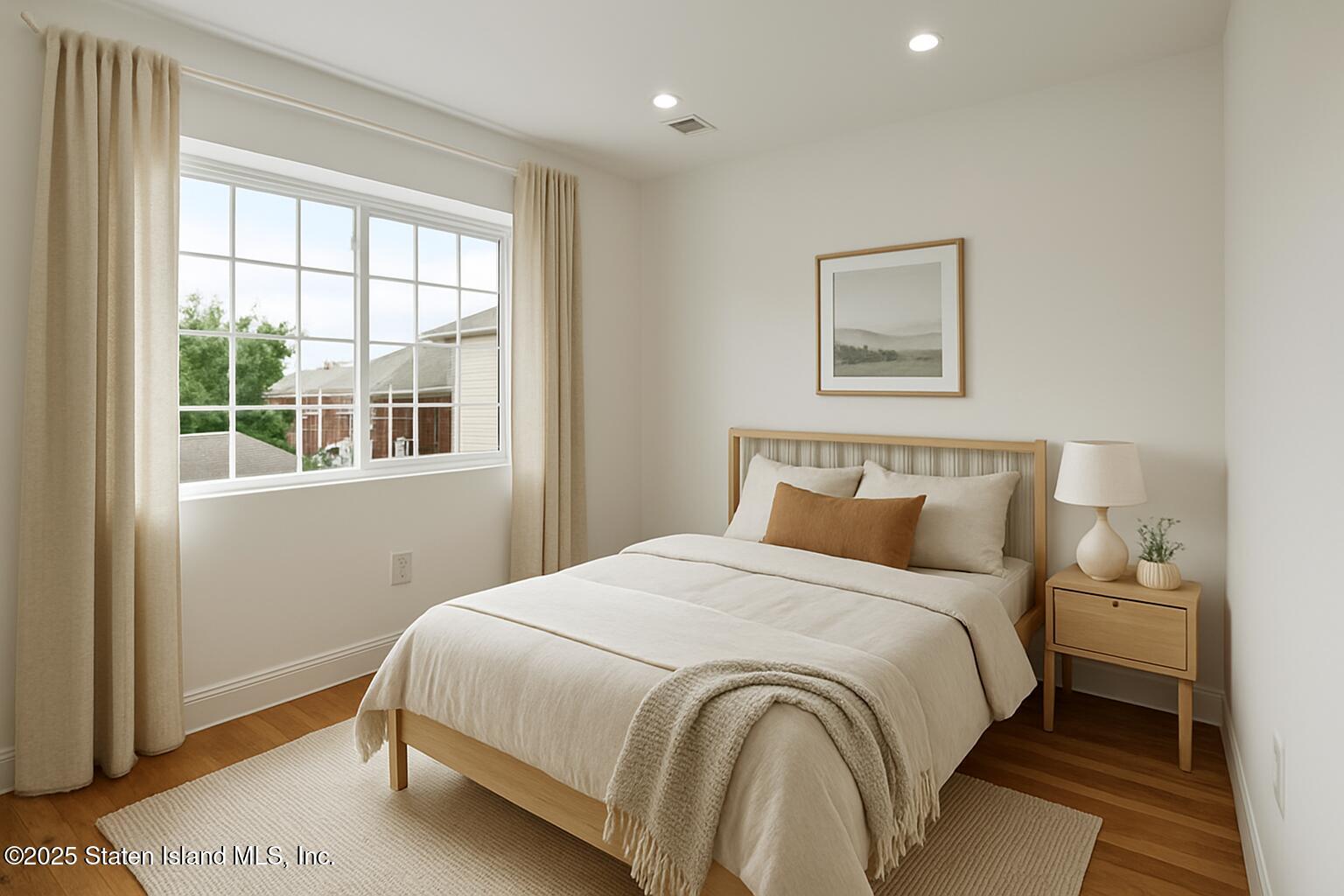 1384 Clove Road Staten Island, NY 10301 - Photo 47 of 51 a bedroom with a bed and a window